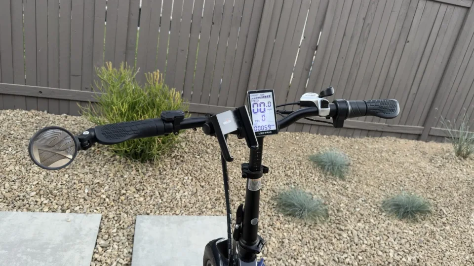 Lectric handlebar setup with LCD display, bar-end mirror, and phone holder