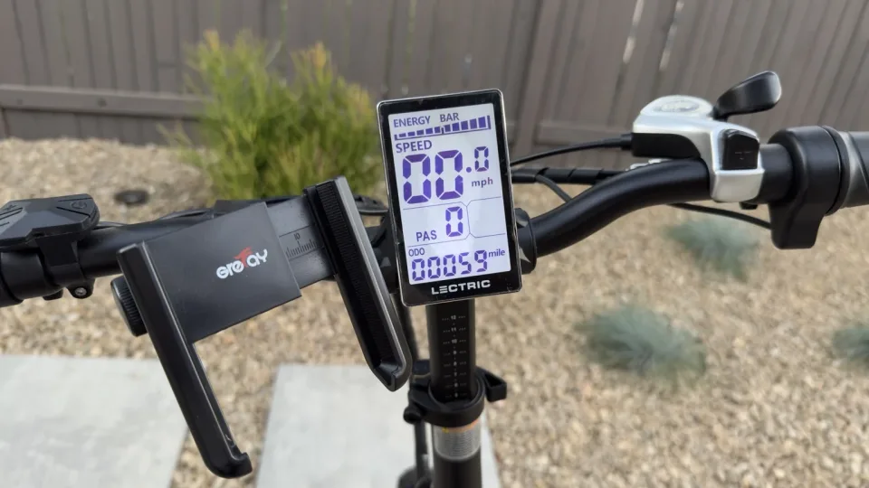 Wide view of the Lectric cockpit with the LCD odometer reading 00059 miles